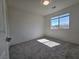 Bright bedroom featuring carpeted floors and a window at 5817 Bonita Rose St, Las Vegas, NV 89113