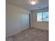 Inviting bedroom with neutral walls, plush carpeting, and a bright window at 5817 Bonita Rose St, Las Vegas, NV 89113