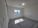 Bright bedroom featuring carpeted floors and a window at 5817 Bonita Rose St, Las Vegas, NV 89113