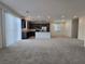 Bright open floorplan that connects living room and modern kitchen with stainless steel appliances at 5817 Bonita Rose St, Las Vegas, NV 89113