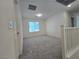 Upstairs loft with plush carpet, neutral walls, and a window at 5817 Bonita Rose St, Las Vegas, NV 89113