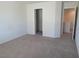 Spacious bedroom boasts neutral carpet and walk-in closet with plenty of space at 6168 Scarlet Leaf St, Las Vegas, NV 89148