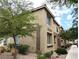 Side view of a two-story home showcasing manicured landscaping and desert foliage at 6168 Scarlet Leaf St, Las Vegas, NV 89148