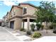 Two-story home with open car port, white fence, and low maintenance landscaping at 6168 Scarlet Leaf St, Las Vegas, NV 89148