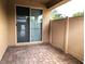 Cozy covered patio with pavers and sliding glass door, perfect for relaxation and outdoor entertaining at 6168 Scarlet Leaf St, Las Vegas, NV 89148