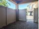 Private covered patio featuring pavers and a gated entrance to the property, providing outdoor living space at 6168 Scarlet Leaf St, Las Vegas, NV 89148