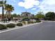Community playground near apartments features mature trees, landscaping and picnic tables at 6168 Scarlet Leaf St, Las Vegas, NV 89148