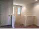 This stairway leads to the upper level of the home with carpeted floors and bright white walls at 6168 Scarlet Leaf St, Las Vegas, NV 89148