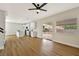 Open floor plan showcasing living room and modern kitchen with a sliding glass door to the backyard at 6388 Canyon Dawn Ave, Las Vegas, NV 89108
