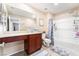 Bright bathroom with bath tub, single vanity and an integrated makeup area at 6650 Drusilla St, North Las Vegas, NV 89084