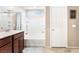 Bathroom with a shower and tub combination and dark wood vanity at 6650 Drusilla St, North Las Vegas, NV 89084