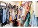 Walk-in closet with organized clothing racks, shelves, and ample storage space at 6650 Drusilla St, North Las Vegas, NV 89084