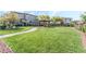 Green community park featuring a green lawn, walking path, landscaped areas, and a shaded gazebo at 6650 Drusilla St, North Las Vegas, NV 89084