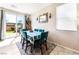 Bright dining area with a large window and seating for six at 6650 Drusilla St, North Las Vegas, NV 89084