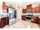 The spacious kitchen features stainless steel appliances, granite countertops, and beautiful dark wood cabinetry at 6650 Drusilla St, North Las Vegas, NV 89084