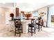 Stylish kitchen with granite countertops, stainless steel appliances, and bar stool seating at 6650 Drusilla St, North Las Vegas, NV 89084