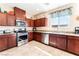 This kitchen features stainless steel appliances, beautiful granite countertops, and ample cabinet space at 6650 Drusilla St, North Las Vegas, NV 89084