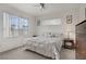 Inviting bedroom with a large bed, windows offering views, and tasteful decor for a relaxing ambiance at 7119 S Durango Dr # 303, Las Vegas, NV 89113