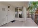 Unit 303 front porch with a white door, black hardware, and space for outdoor seating at 7119 S Durango Dr # 303, Las Vegas, NV 89113