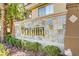 Elegant community signage with lush landscaping, adding curb appeal and welcoming residents at 7119 S Durango Dr # 303, Las Vegas, NV 89113