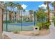 Well-maintained tennis court surrounded by lush greenery, providing recreational opportunities for residents at 7119 S Durango Dr # 303, Las Vegas, NV 89113