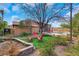 A unique backyard features mature trees, colorful seating and a built-in trampoline at 7470 Eldora Av, Las Vegas, NV 89117