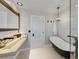 Relaxing bathroom with soaking tub, modern vanity, and stylish lighting at 7470 Eldora Av, Las Vegas, NV 89117