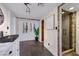 Sleek bathroom featuring a glass shower and modern vanity with stylish fixtures at 7470 Eldora Av, Las Vegas, NV 89117