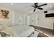Cozy bedroom featuring a ceiling fan, a television, and double doors leading to an adjacent room at 7470 Eldora Av, Las Vegas, NV 89117