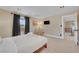 Bright bedroom with balcony access, neutral decor and a flatscreen tv at 7470 Eldora Av, Las Vegas, NV 89117
