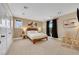 Light-filled bedroom featuring plush carpeting, a window and an ensuite bath at 7470 Eldora Av, Las Vegas, NV 89117