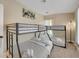 Bedroom with bunk beds and neutral decor; a cozy space for children or guests at 7470 Eldora Av, Las Vegas, NV 89117