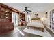 Inviting bedroom featuring built-in shelving and a cozy bed with natural light at 7470 Eldora Av, Las Vegas, NV 89117