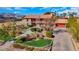 Charming two-story home with mature trees, a stone walkway, and a red-tiled roof at 7470 Eldora Av, Las Vegas, NV 89117