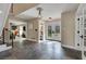 Inviting home foyer featuring slate floors, staircase, and decorative lighting at 7470 Eldora Av, Las Vegas, NV 89117