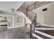Inviting foyer featuring slate floors, staircase, and a view into a bedroom at 7470 Eldora Av, Las Vegas, NV 89117