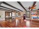 Large game room with hardwood floors, ample lighting, and multiple game tables for entertainment at 7470 Eldora Av, Las Vegas, NV 89117
