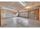 A spacious garage with storage racks and plenty of parking at 7470 Eldora Av, Las Vegas, NV 89117