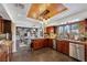 Open-concept kitchen with wooden cabinets, and stainless steel appliances at 7470 Eldora Av, Las Vegas, NV 89117