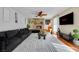 Spacious living room with a stone fireplace, modern decor, and plenty of seating at 7470 Eldora Av, Las Vegas, NV 89117