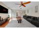 Modern living room with sleek furniture, a large TV, and stylish decor at 7470 Eldora Av, Las Vegas, NV 89117
