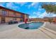 An in-ground pool, hot tub and chairs adorn a beautiful backyard at this two-story home at 7470 Eldora Av, Las Vegas, NV 89117