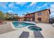 Beautiful pool and jacuzzi with lounge chairs and a hammock, perfect for outdoor relaxation and enjoyment at 7470 Eldora Av, Las Vegas, NV 89117