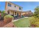 Inviting backyard features a covered patio, artificial grass, and thoughtfully landscaped areas perfect for outdoor entertaining at 756 Arden Valley Ave, Henderson, NV 89011