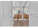 Bathroom features a dual sink vanity, and a mirror with sliding glass doors at 756 Arden Valley Ave, Henderson, NV 89011