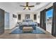 Brightly lit bedroom featuring a ceiling fan and large window for plenty of natural light at 756 Arden Valley Ave, Henderson, NV 89011