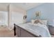 Cozy bedroom featuring a queen bed, blue accent wall, closet, and soft carpeting at 756 Arden Valley Ave, Henderson, NV 89011