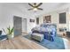 Primary bedroom features a ceiling fan, bedside tables, and an accent rug at 756 Arden Valley Ave, Henderson, NV 89011