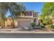 Charming two-story home featuring a neutral color palette, tile roof, attached garage, and tidy front yard at 756 Arden Valley Ave, Henderson, NV 89011