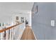 Second story hallway has wood flooring and views of living space at 756 Arden Valley Ave, Henderson, NV 89011